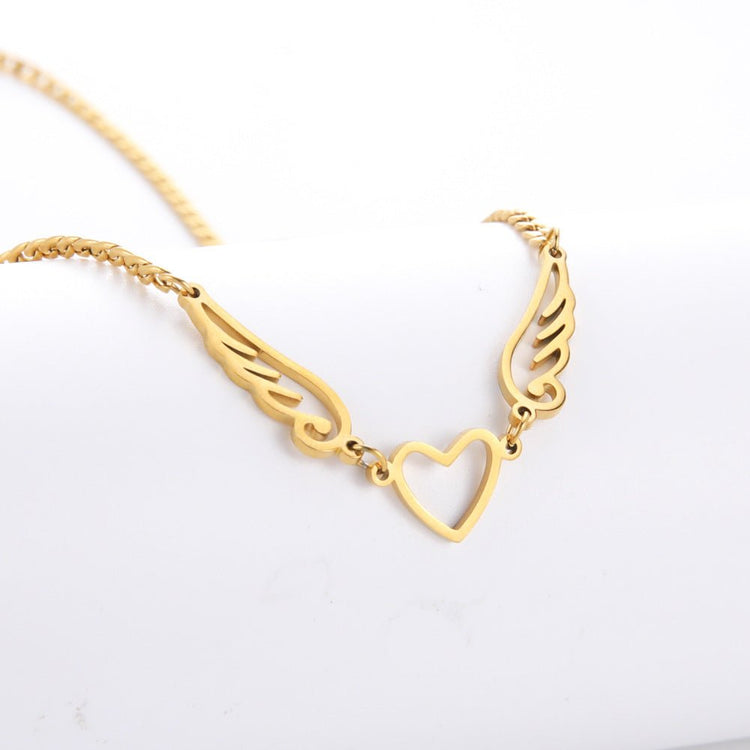 Hollow Heart Angel Wing Necklace - Serenity Spaces